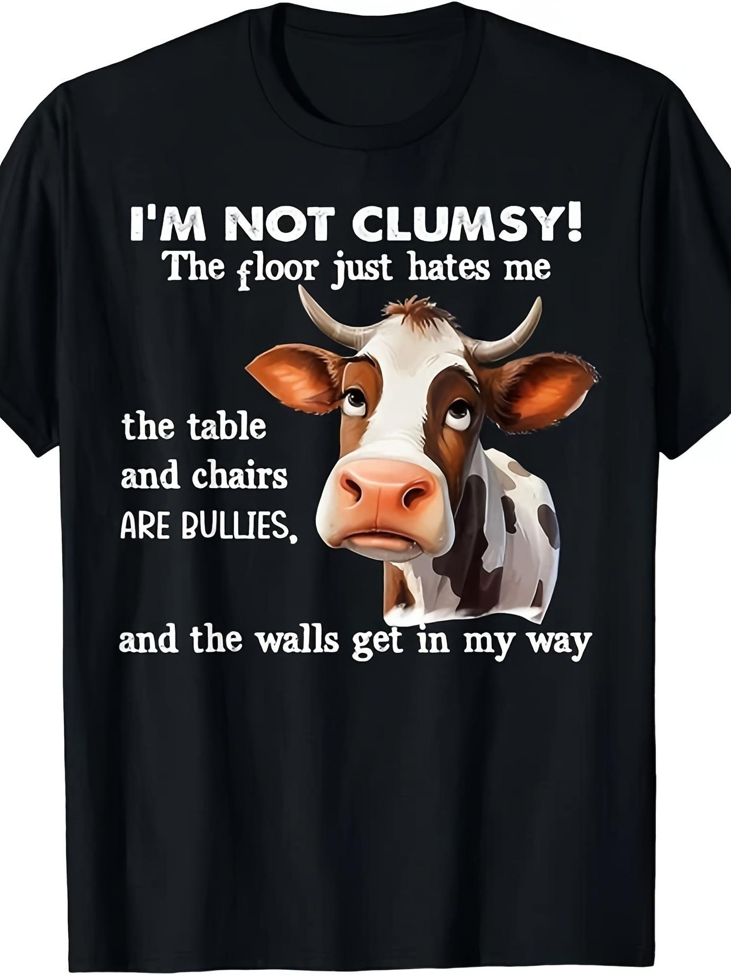 Men's Funny T Shirt, Humorous Design Featuring a Cute Cartoon Cow, Light Hearted Quote 'I'M NOT CLUMSY! The Floor Just Hates Me', Playful Excuse for Clumsiness, Comfortable Fit, Perfect for Casual Outings, Great for Those Who Appreci